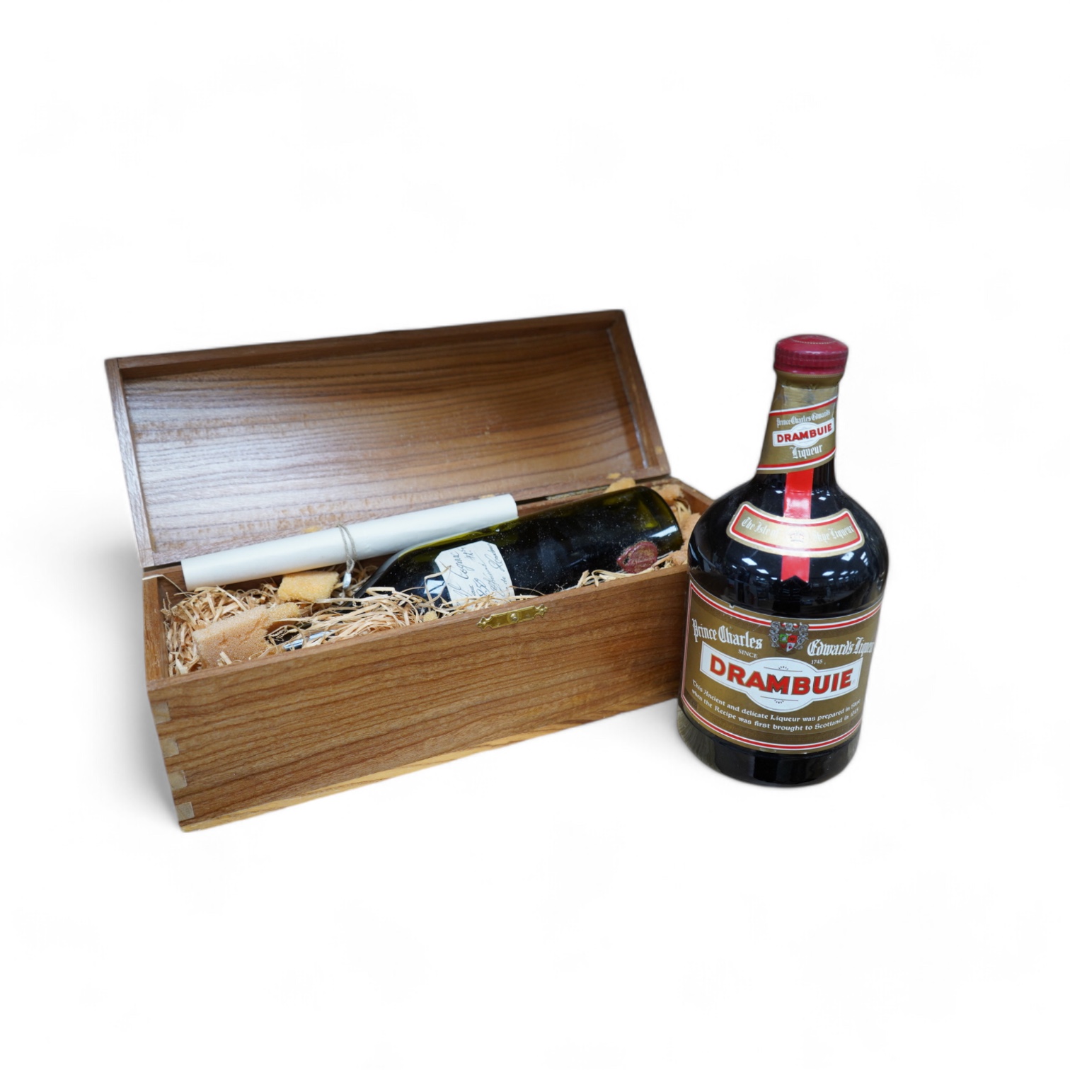 A cased bottle of Guy Lheraud ‘Tres Vieux’ Cognac, 1950 with certificate, together with a bottle of Drambuie. Condition - fair externally